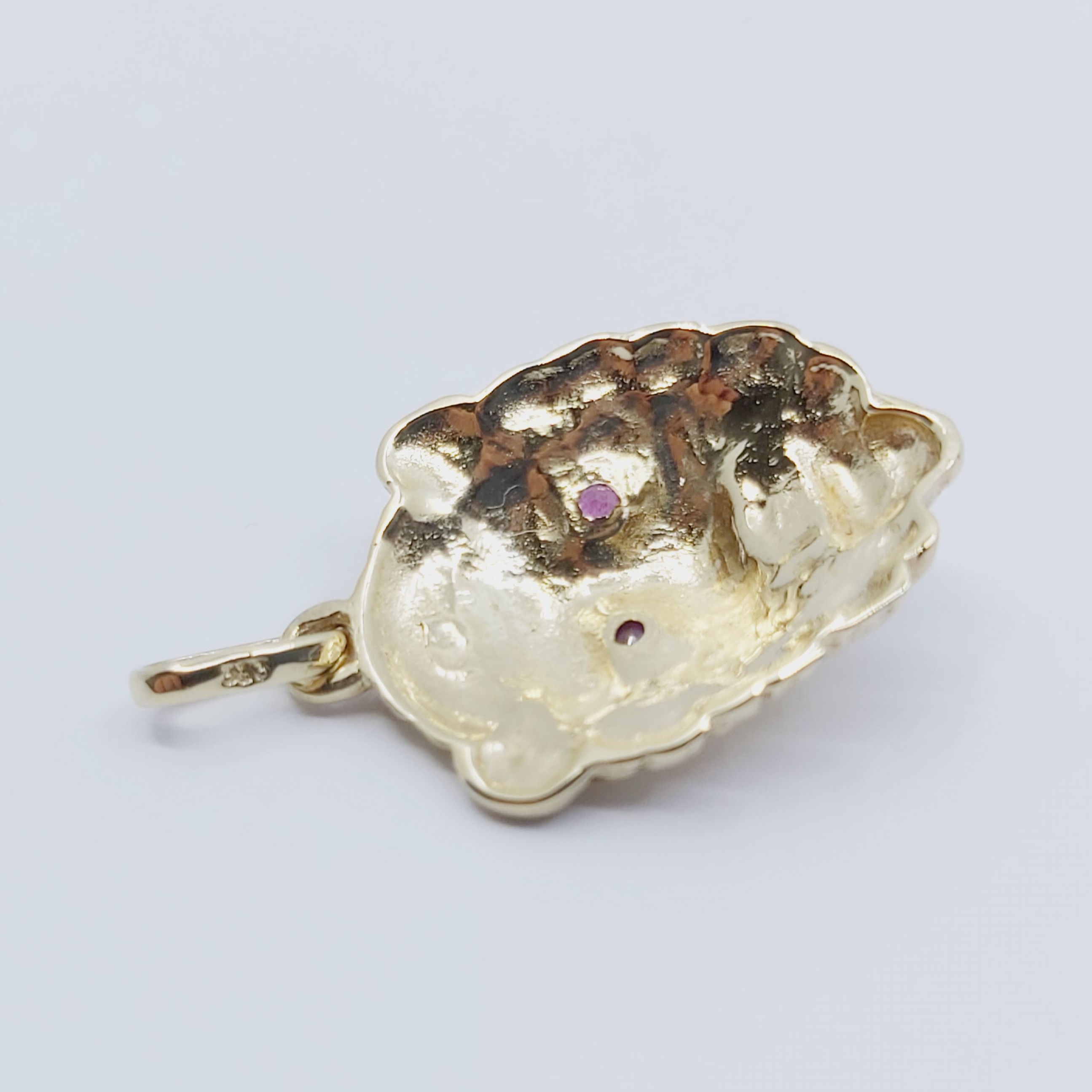 Anhänger 333/- "Löwe" mit Diamant und Rubine, 4,21g